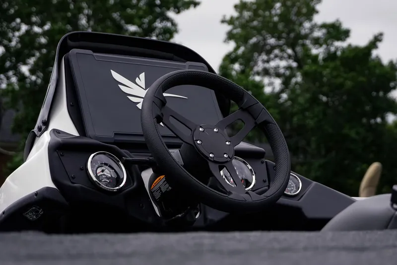 Slide: The Image of Steering wheel of 2026 Skeeter ZXR20 SE boat with dashboard and gauges. - 21