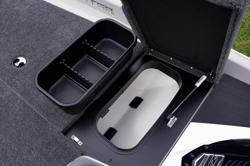 Slide: The Image of 2026 Skeeter ZXR20 SE boat storage compartments with open lids and organized interior. - 28