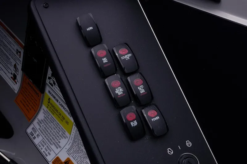 Slide: The Image of Control panel of 2026 Skeeter ZXR20 SE boat with labeled switches. - 34