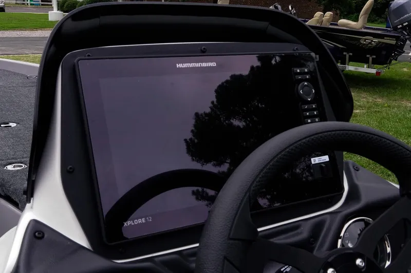 Slide: The Image of 2026 Skeeter ZXR20 SE boat dashboard with Humminbird Xplore 12 display and steering wheel. - 36