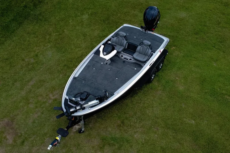 Slide: The Image of 2026 Skeeter ZXR20 SE boat on grass, aerial view, showcasing seating and deck layout. - 4