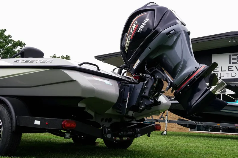 Slide: The Image of 2026 Skeeter ZXR20 SE boat with Yamaha engine on a trailer, parked on grass. - 42