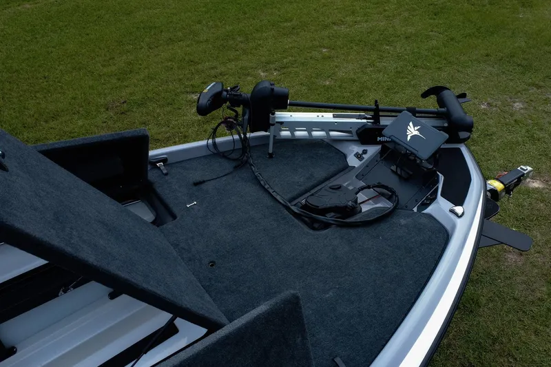 Slide: The Image of 2026 Skeeter ZXR20 SE boat deck with advanced fishing equipment on grassy background. - 8