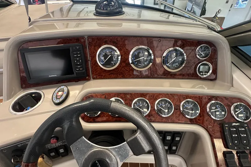 Slide: The Image of Dashboard of a 2005 Formula 280 Sun Sport boat with gauges and Garmin display. - 11