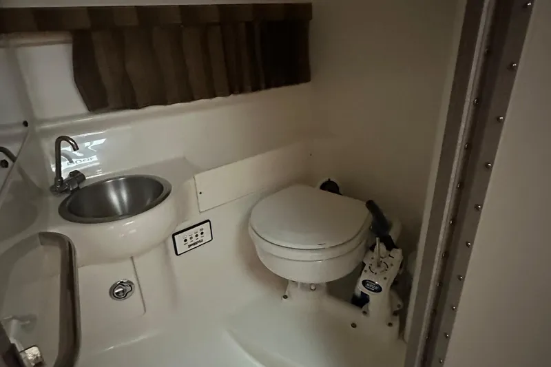 Slide: The Image of 2005 Formula 280 Sun Sport boat bathroom with sink and toilet. - 15