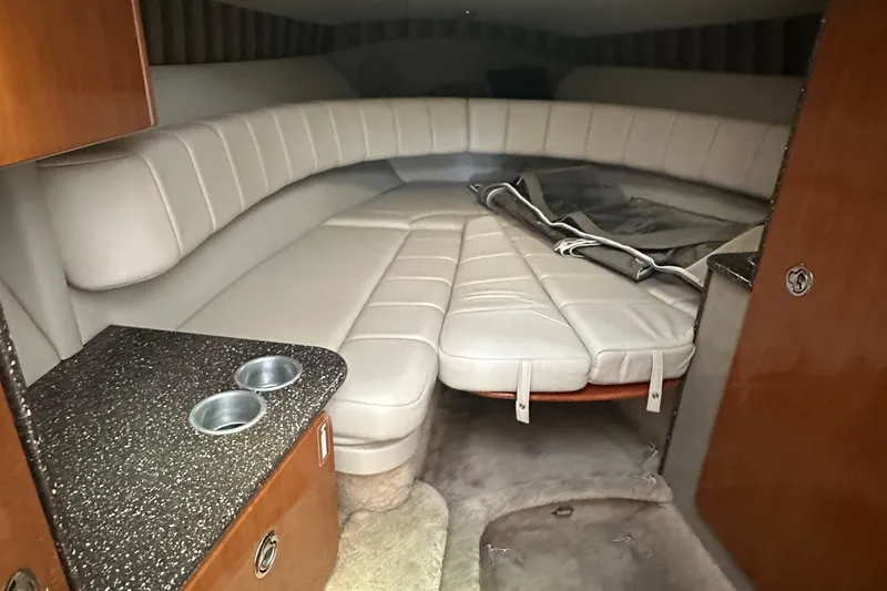 Slide: The Image of 2005 Formula 280 Sun Sport cabin interior with beige seating and countertop. - 17