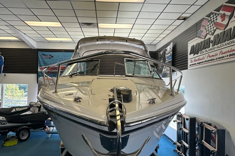 Slide: The Image of 2005 Formula 280 Sun Sport boat displayed indoors at Aqua-Mania showroom. - 2