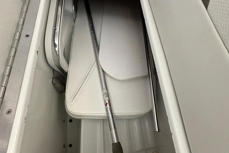Slide: The Image of Storage compartment of a 2005 Formula 280 Sun Sport boat with metal pole. - 20