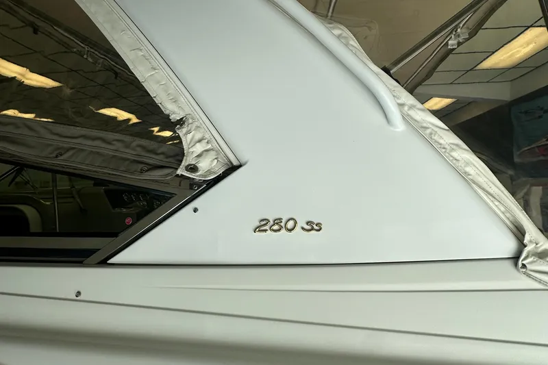 Slide: The Image of 2005 Formula 280 Sun Sport boat, white exterior with "280 ss" emblem. - 5