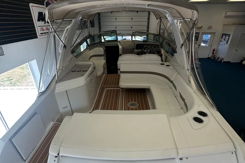Slide: The Image of 2005 Formula 280 Sun Sport boat interior with white seating and wood flooring. - 9