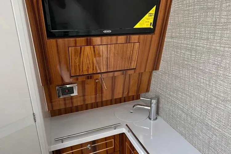 Slide: The Image of Luxurious interior of 2025 HCB 42 Lujo yacht with sleek wood finish and modern amenities. - 14