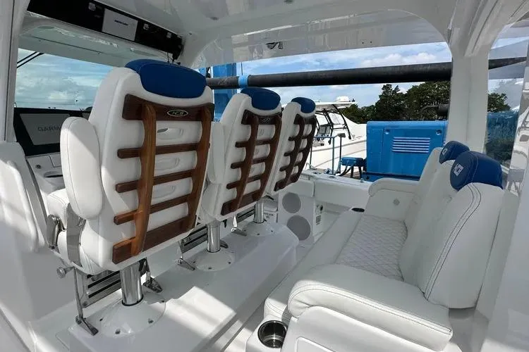 Slide: The Image of 2025 HCB 42 Lujo boat interior with luxurious white seating and modern design. - 3