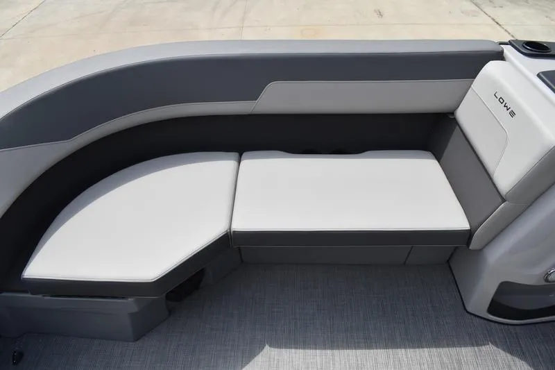 Slide: The Image of 2026 Lowe LS 190 pontoon boat with black exterior and canopy on a trailer. - 10