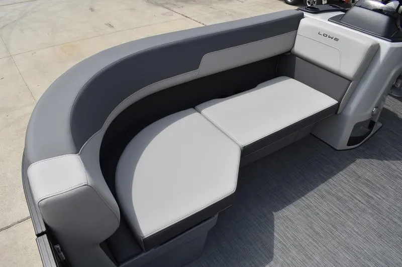 Slide: The Image of 2026 Lowe LS 190 boat interior with gray and white cushioned seating. - 16