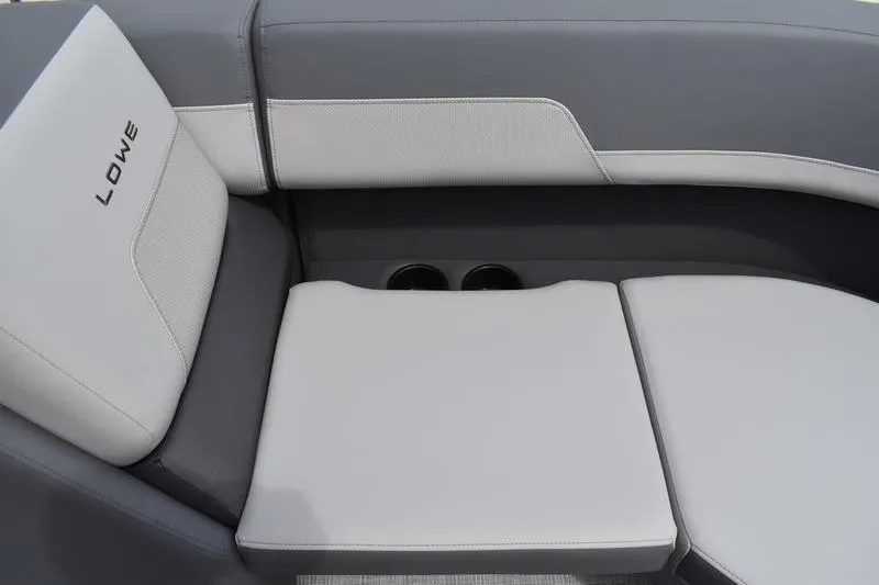 Slide: The Image of 2026 Lowe LS 190 boat interior storage compartment with cushioned seating. - 19