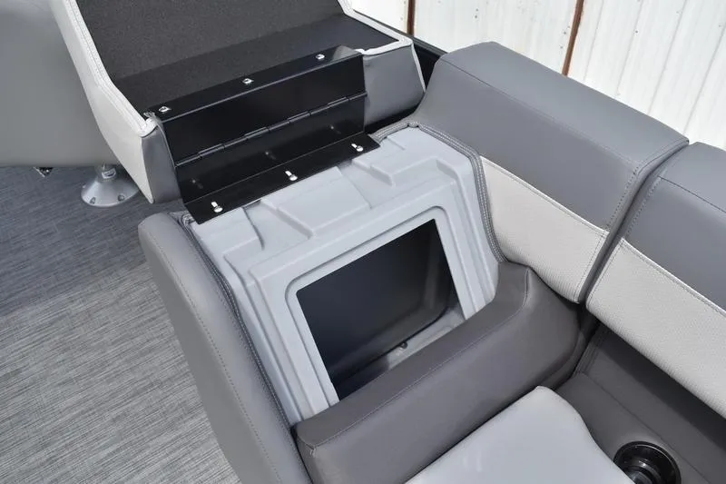 Slide: The Image of Interior of 2026 Lowe LS 190 boat with storage compartment and cup holders. - 25