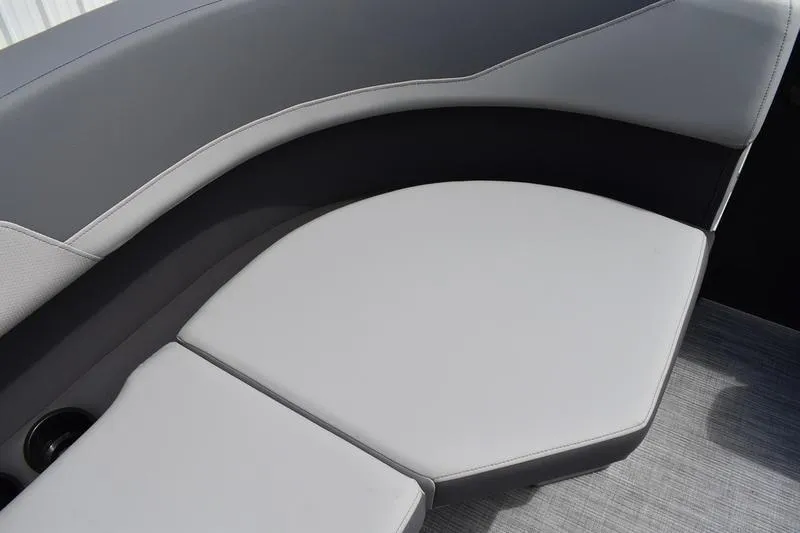 Slide: The Image of 2026 Lowe LS 190 boat storage compartment with cushioned seating and sleek design. - 27