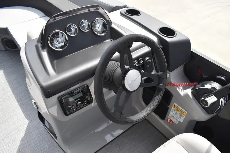 Slide: The Image of Control panel of 2026 Lowe LS 190 boat with ignition and switches. - 38