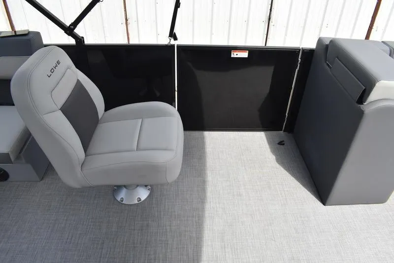 Slide: The Image of Control panel and capacity label on 2026 Lowe LS 190 boat interior. - 39