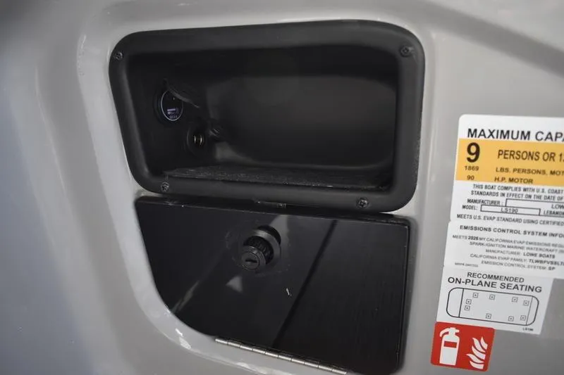 Slide: The Image of Interior of 2026 Lowe LS 190 boat featuring steering console and comfortable seating. - 40