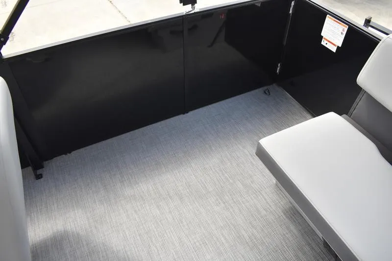 Slide: The Image of Interior view of 2026 Lowe LS 190 boat storage compartment, featuring sleek gray design. - 46