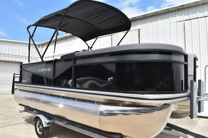 Slide: The Image of 2026 Lowe LS 190 pontoon boat with Mercury engine and foldable ladder. - 5