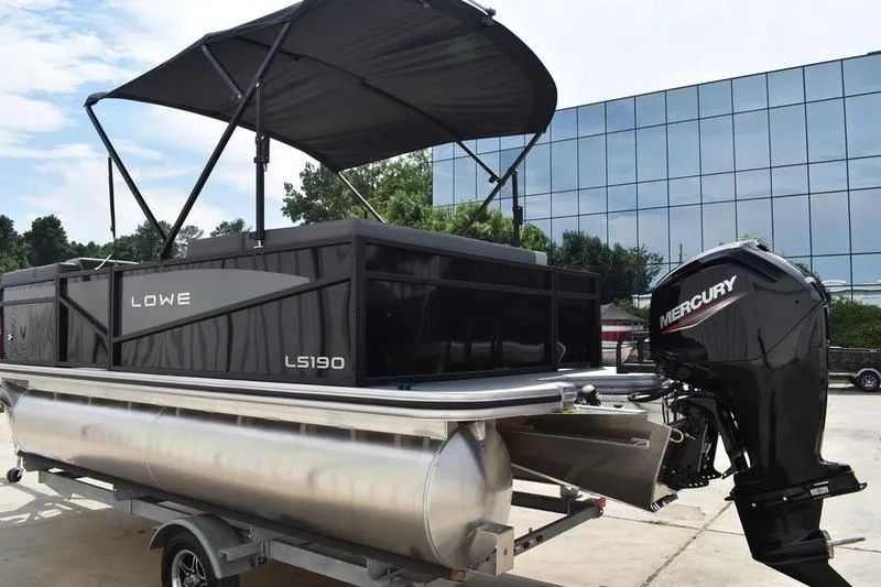 Slide: The Image of Close-up of a 2026 Lowe LS 190 boat engine, featuring "90 CT Command Thrust" branding. - 8