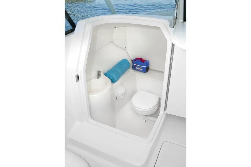 Slide: The Image of Manufacturer Provided Image: 2016 Pursuit DC 265 Dual Console boat interior bathroom with toilet and sink. - 37