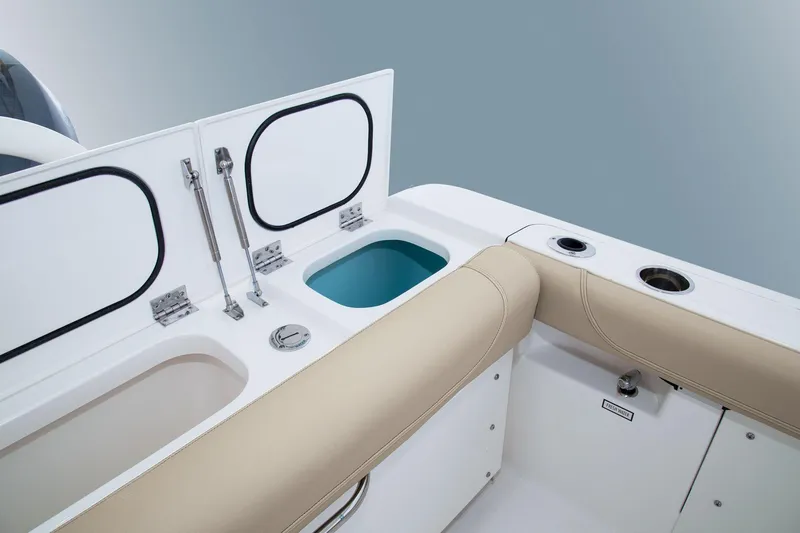 Slide: The Image of Manufacturer Provided Image: 2016 Pursuit DC 265 Dual Console boat interior with storage compartments and seating. - 38