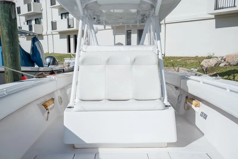 Slide: The Image of 2009 SeaHunter 40 boat interior with white seating and modern design. - 20