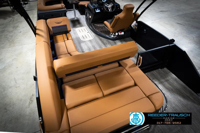 Slide: The Image of 2026 Bennington 22 MSB boat interior with tan seating and modern dashboard. - 13