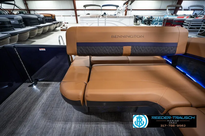 Slide: The Image of Luxurious interior of 2026 Bennington 22 MSB pontoon boat with tan seating. - 16