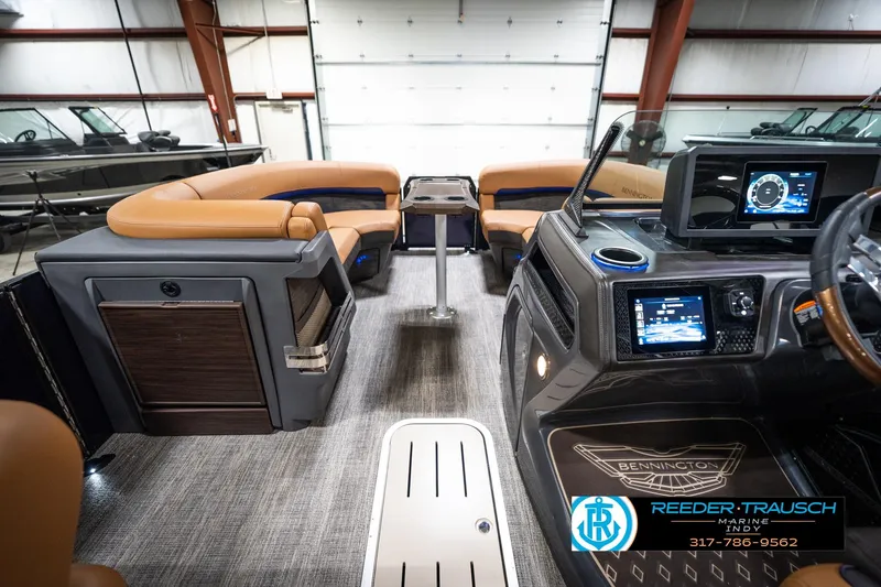 Slide: The Image of 2026 Bennington 22 MSB boat interior with modern dashboard and luxurious seating. - 18