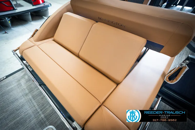 Slide: The Image of 2026 Bennington 22 MSB boat with tan leather seating, showcased by Reeder-Trausch Marine. - 29