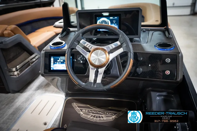 Slide: The Image of 2026 Bennington 22 MSB boat dashboard with modern steering wheel and digital displays. - 33