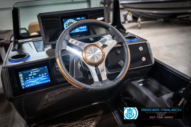 Slide: The Image of Steering console of 2026 Bennington 22 MSB boat with digital displays and controls. - 34