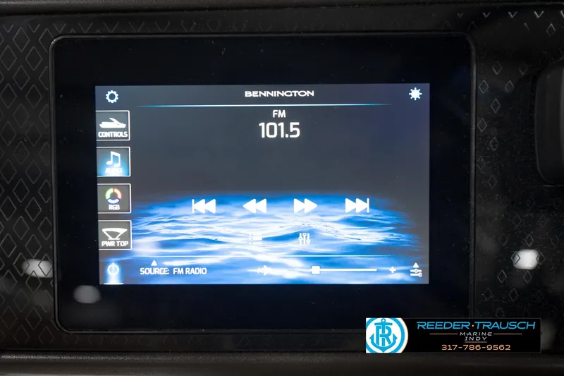 Slide: The Image of Touchscreen display of 2026 Bennington 22 MSB showing FM radio controls at 101.5 frequency. - 36