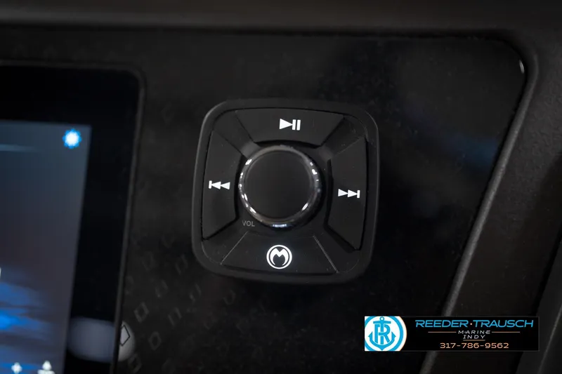 Slide: The Image of Control panel of 2026 Bennington 22 MSB boat with volume and playback buttons. - 37
