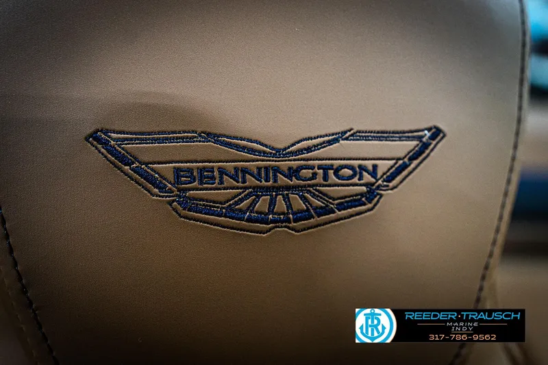 Slide: The Image of Embroidered Bennington logo on 2026 Bennington 22 MSB boat seat, Reeder-Trausch Marine contact info. - 42