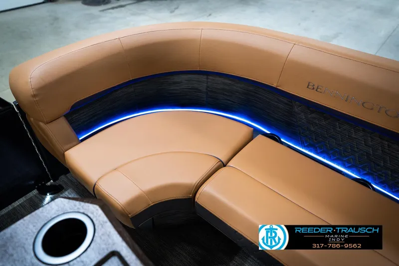 Slide: The Image of Luxurious seating on 2026 Bennington 22 MSB boat with ambient blue lighting. - 44