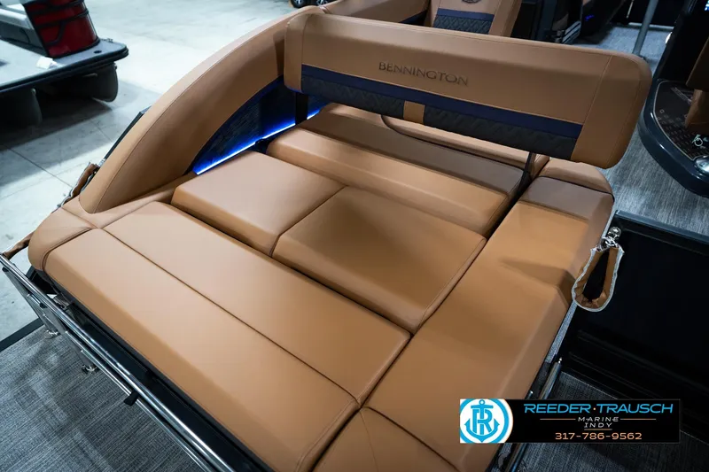 Slide: The Image of 2026 Bennington 22 MSB boat interior with luxurious tan seating and ambient lighting. - 46