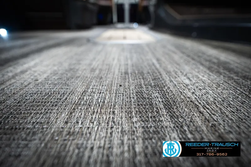 Slide: The Image of 2026 Bennington 22 MSB boat flooring, textured surface, Reeder-Trausch Marine logo visible. - 50