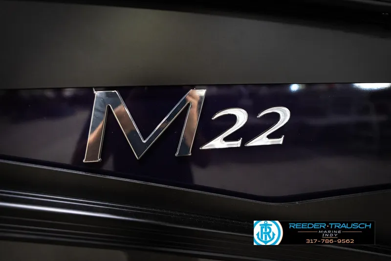 Slide: The Image of Close-up of 2026 Bennington 22 MSB model emblem with dealership logo. - 53