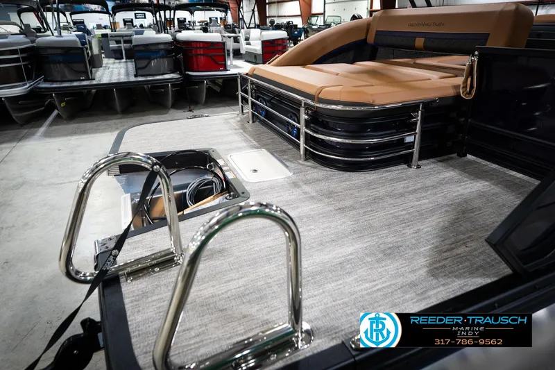 Slide: The Image of 2026 Bennington 22 MSB pontoon boat interior with tan seating and stainless steel ladder. - 54