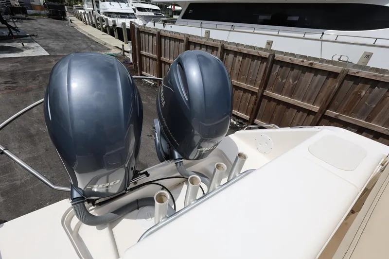 Slide: The Image of 2017 Pursuit DC 265 Dual Console with twin Yamaha 200 engines docked. - 25