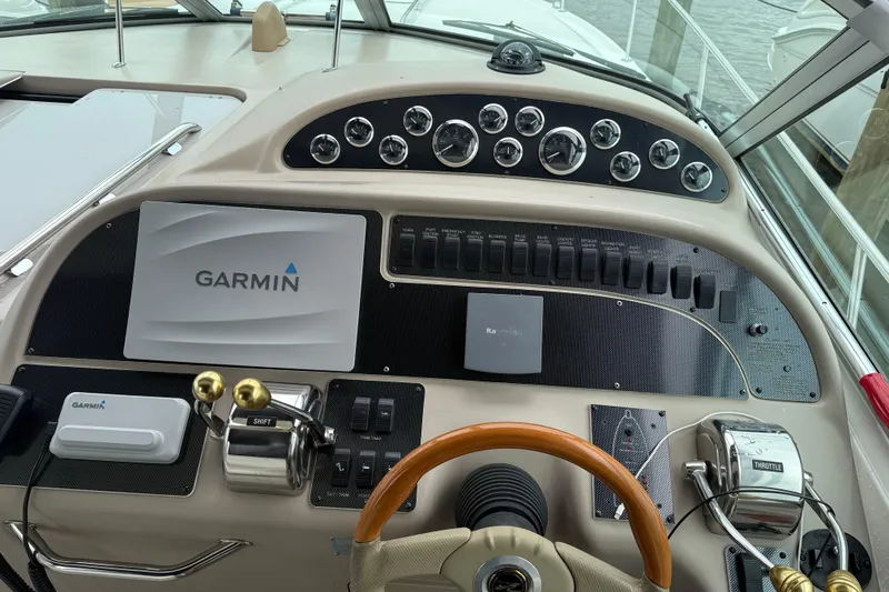 Slide: The Image of Dashboard of a 2001 Sea Ray 310 Sundancer with Garmin navigation system. - 15