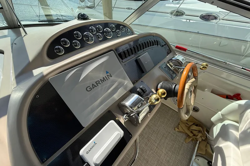 Slide: The Image of Control panel of 2001 Sea Ray 310 Sundancer with Garmin navigation system. - 18