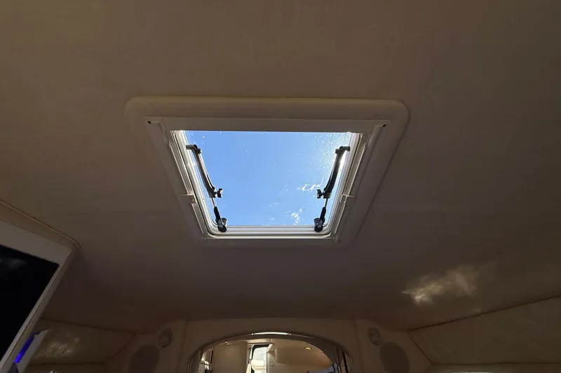 Slide: The Image of Cabin skylight view inside 2001 Sea Ray 310 Sundancer boat. - 36