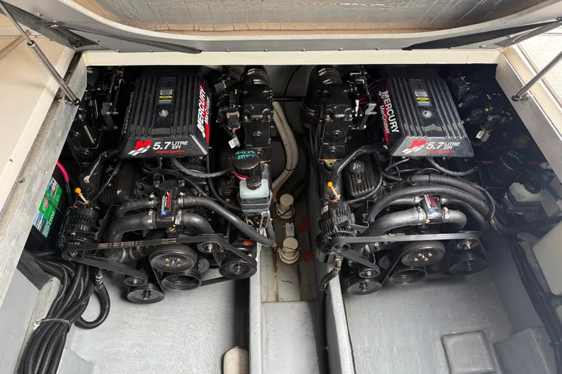 Slide: The Image of Engine compartment of a 2001 Sea Ray 310 Sundancer with twin 5.7L Mercury engines. - 55