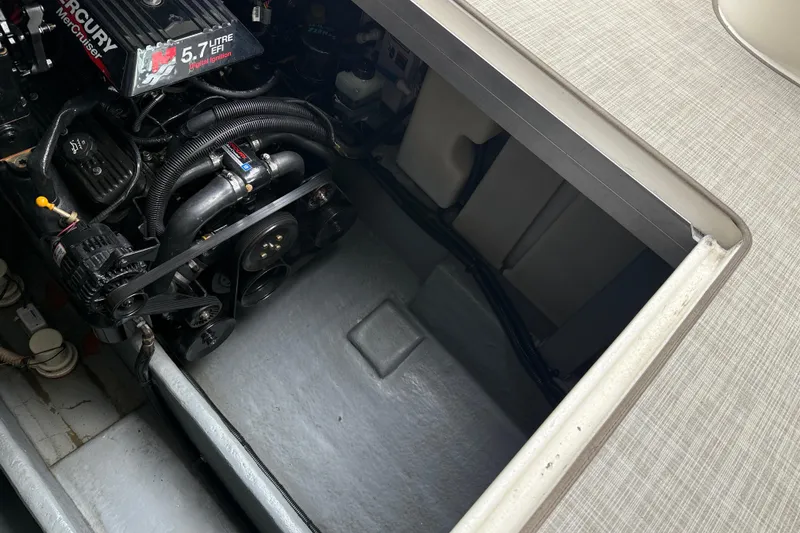 Slide: The Image of Engine compartment of a 2001 Sea Ray 310 Sundancer with a 5.7L Mercury engine. - 58